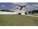 A white, two-story home is framed by a green yard and a white fence at 170 Kinsale Ct, Garner, NC 27529