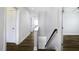 Hallway with hard surface flooring, neutral paint, and recessed lights leading to bedrooms and living spaces at 170 Kinsale Ct, Garner, NC 27529