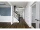 Hallway with dark wood floors and neutral colored walls at 170 Kinsale Ct, Garner, NC 27529