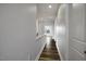 Hallway with hard surface flooring, neutral paint, and recessed lights leading to bedrooms and living spaces at 170 Kinsale Ct, Garner, NC 27529
