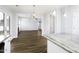 Open kitchen featuring granite countertops, stainless steel appliances, and an eat-in breakfast bar at 170 Kinsale Ct, Garner, NC 27529