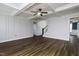 Spacious living room with dark brown laminate wood floor, open space, and coffered ceiling at 170 Kinsale Ct, Garner, NC 27529