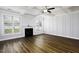 Bright, open living room with fireplace, large windows, and coffered ceiling at 170 Kinsale Ct, Garner, NC 27529