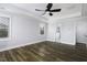 Bright main bedroom features wood-look floors, tray ceiling, and windows for natural light at 170 Kinsale Ct, Garner, NC 27529