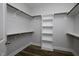 Spacious walk-in closet with shelves and hanging rods offers ample storage space at 170 Kinsale Ct, Garner, NC 27529