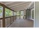 Relaxing back porch with wood floors and a view of the private backyard at 1801 Sagamore Ct, Raleigh, NC 27604