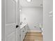 Bright bathroom featuring a modern vanity and wood-look flooring at 1801 Sagamore Ct, Raleigh, NC 27604