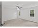 Spacious bedroom featuring two windows for natural light and a ceiling fan at 1801 Sagamore Ct, Raleigh, NC 27604