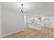 Dining area adjacent to kitchen, featuring modern lighting and open layout at 1801 Sagamore Ct, Raleigh, NC 27604