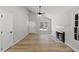 Bright living room with hardwood floors and a cozy fireplace at 1801 Sagamore Ct, Raleigh, NC 27604