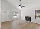 Living room with hardwood floors, a fireplace, and view of the front yard at 1801 Sagamore Ct, Raleigh, NC 27604