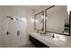 Modern bathroom features a double vanity, sleek fixtures, and walk-in shower with stylish tile work at 1804 Pershing Rd, Raleigh, NC 27608