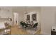Elegant dining room showcasing a table with seating for six and contemporary art at 1804 Pershing Rd, Raleigh, NC 27608