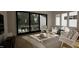 Bright living room showcasing modern furniture, a stylish rug, and large sliding glass doors at 1804 Pershing Rd, Raleigh, NC 27608