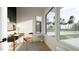Chic office featuring a contemporary desk, stylish chair, and ample natural light through a large window at 1804 Pershing Rd, Raleigh, NC 27608