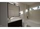 Modern bathroom with a sleek vanity, tiled shower, and contemporary fixtures at 1806 Pershing Rd, Raleigh, NC 27608