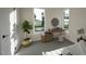 Bright bedroom featuring a vanity, sleek decor, and large windows with a scenic outdoor view at 1806 Pershing Rd, Raleigh, NC 27608