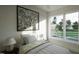 Serene bedroom featuring modern artwork, large windows, and comfortable bedding at 1806 Pershing Rd, Raleigh, NC 27608