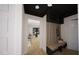 Welcoming foyer with bench and hooks leading to the living room at 1806 Pershing Rd, Raleigh, NC 27608