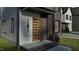 Close-up of a modern wood door with unique vertical slats, set against a stylish brick exterior at 1806 Pershing Rd, Raleigh, NC 27608