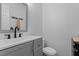 Modern bathroom with gray vanity, and white toilet for comfortable living at 2 Capri Ter, Durham, NC 27703