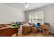 Bright bedroom with a ceiling fan and filled with boxes at 2 Capri Ter, Durham, NC 27703