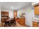 Cozy dining area features wood flooring, a wooden table and a cabinet for storage at 2 Capri Ter, Durham, NC 27703