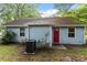 Charming home with a well-maintained yard, and a red front door at 2 Capri Ter, Durham, NC 27703