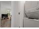 Convenient laundry area with stacked washer and dryer for efficient space saving at 2 Capri Ter, Durham, NC 27703