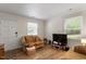 Bright living room featuring wood floors, television, and comfortable seating arrangement at 2 Capri Ter, Durham, NC 27703
