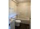 Bathroom featuring standard tub/shower combo, toilet, and a vanity sink with a small cabinet at 2302 Chautauqua Ave, Durham, NC 27707