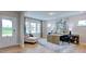 Comfortable home office with large windows, a cozy chaise lounge, and stylish decor at 245 Tidal Pool Way, Cary, NC 27519
