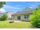 Cozy backyard featuring a brick patio with a fire pit, perfect for outdoor entertaining at 248 Inkster Cv, Raleigh, NC 27603