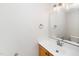 Bathroom featuring a vanity with granite countertop, framed mirror, and light fixture at 248 Inkster Cv, Raleigh, NC 27603