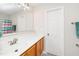 Clean bathroom with spacious counter, updated vanity, mirror and modern fixtures at 248 Inkster Cv, Raleigh, NC 27603