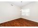 Cozy dining room with hardwood floors, chandelier, and natural light at 248 Inkster Cv, Raleigh, NC 27603