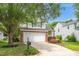 Charming home with a two-car garage, mature tree, landscaped yard, and brick accents at 248 Inkster Cv, Raleigh, NC 27603