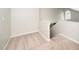 Cozy carpeted landing area with natural light from a window, leading to stairs at 248 Inkster Cv, Raleigh, NC 27603