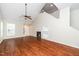 Bright and airy living room with wood floors, fireplace, and staircase at 248 Inkster Cv, Raleigh, NC 27603