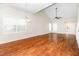 Spacious living room with hardwood floors, vaulted ceiling, and plenty of natural light at 248 Inkster Cv, Raleigh, NC 27603
