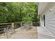 Back deck with seating area overlooking a private, wooded yard at 2705 Vestry Way, Raleigh, NC 27613