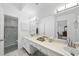 Large bathroom boasts double vanity sinks and a glass enclosed tiled shower at 2705 Vestry Way, Raleigh, NC 27613