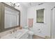 Cozy bathroom includes a white vanity, large mirror and a shower at 2705 Vestry Way, Raleigh, NC 27613
