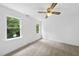 Bright, airy bedroom with carpet, white walls and ample natural light from two windows at 2705 Vestry Way, Raleigh, NC 27613