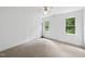 Bright bedroom features neutral carpet, white walls, and a ceiling fan at 2705 Vestry Way, Raleigh, NC 27613