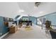 Expansive bonus room with blue walls, a ceiling fan, and natural light at 2705 Vestry Way, Raleigh, NC 27613