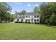 Traditional two-story home featuring a manicured lawn, dormers, and shutters at 2705 Vestry Way, Raleigh, NC 27613