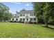 Traditional two-story home featuring a manicured lawn, dormers, and shutters at 2705 Vestry Way, Raleigh, NC 27613