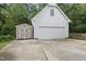Spacious two-car garage with a shed providing ample storage and parking space at 2705 Vestry Way, Raleigh, NC 27613