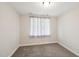 Cozy bedroom with neutral walls, grey carpet and a window with privacy curtains at 271 W Amber Oak Dr, Selma, NC 27576